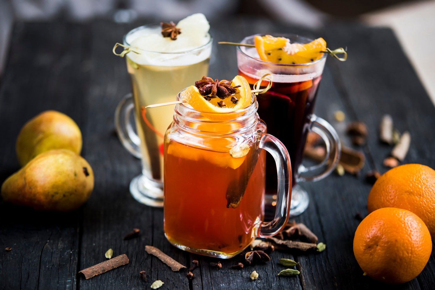 Glasses of spiced wine beverages with garnish